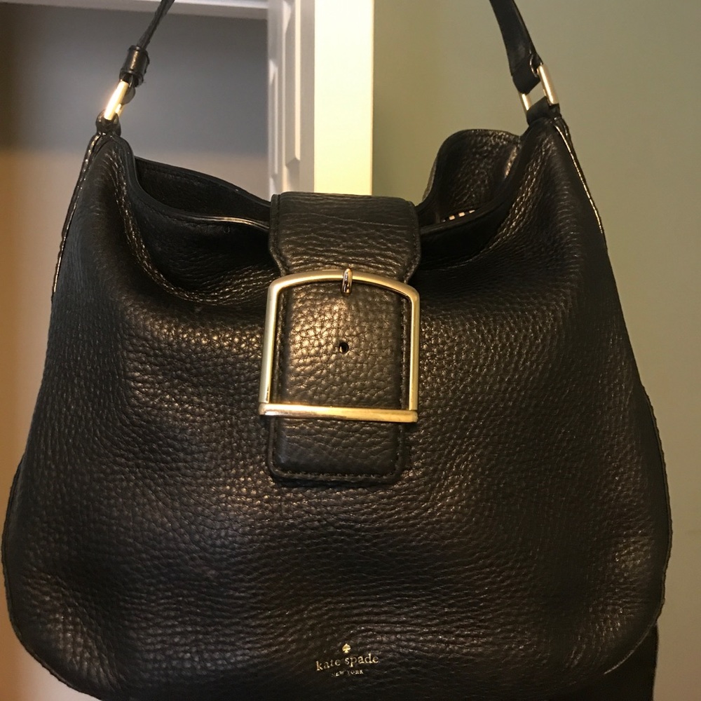 Kate Spade Black purse with gold detail.